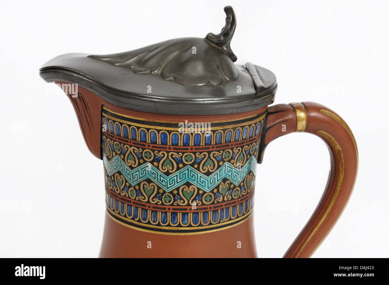 A mid 19th C. English  pewter lidded terracotta pratt ware (prattware) jug printed vividly with designs in the Eastern manner. Stock Photo