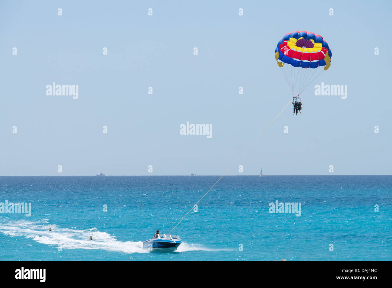 Two girls paragliding above the Mediterranean Sea in Nice, France Stock Photo