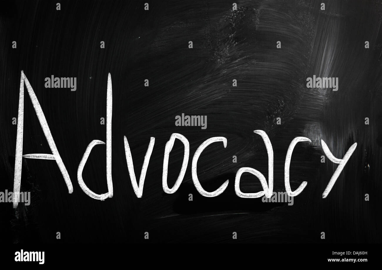 The word 'Advocacy' handwritten with white chalk on a blackboard Stock Photo