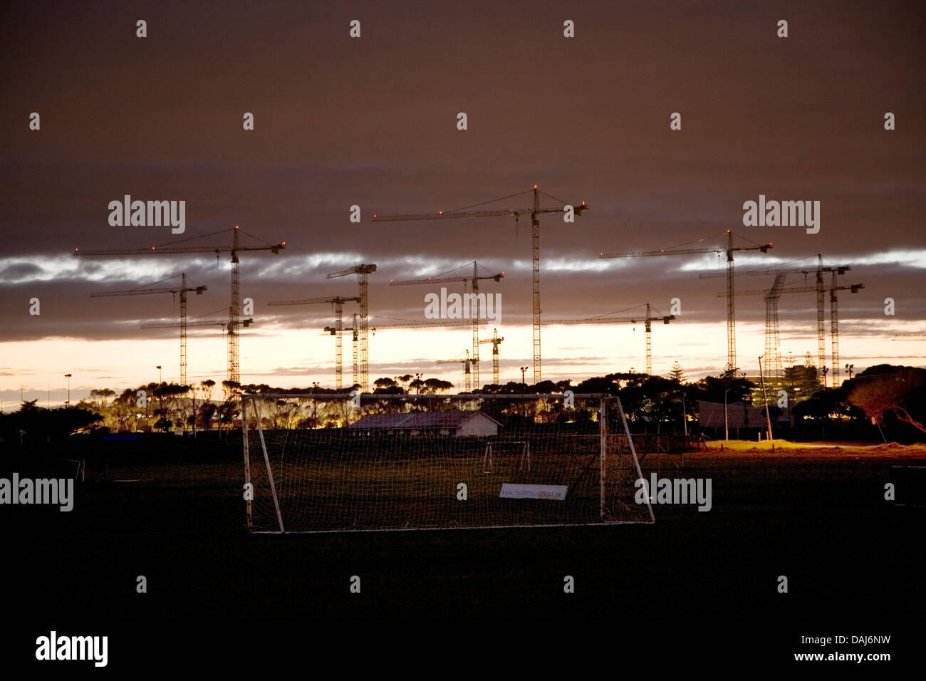Seen soccer fields in Greenpoint construction cranes rise above site