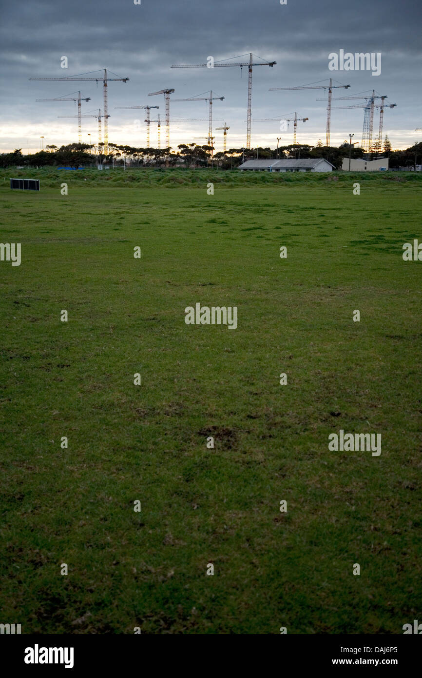 Seen soccer fields in Greenpoint construction cranes rise above site