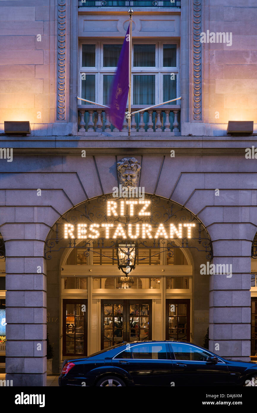 The Ritz London, London, United Kingdom. Architect: Charles Mewes & Arthur Davis, 1906. View of the Ritz restaurant sign lit up Stock Photo