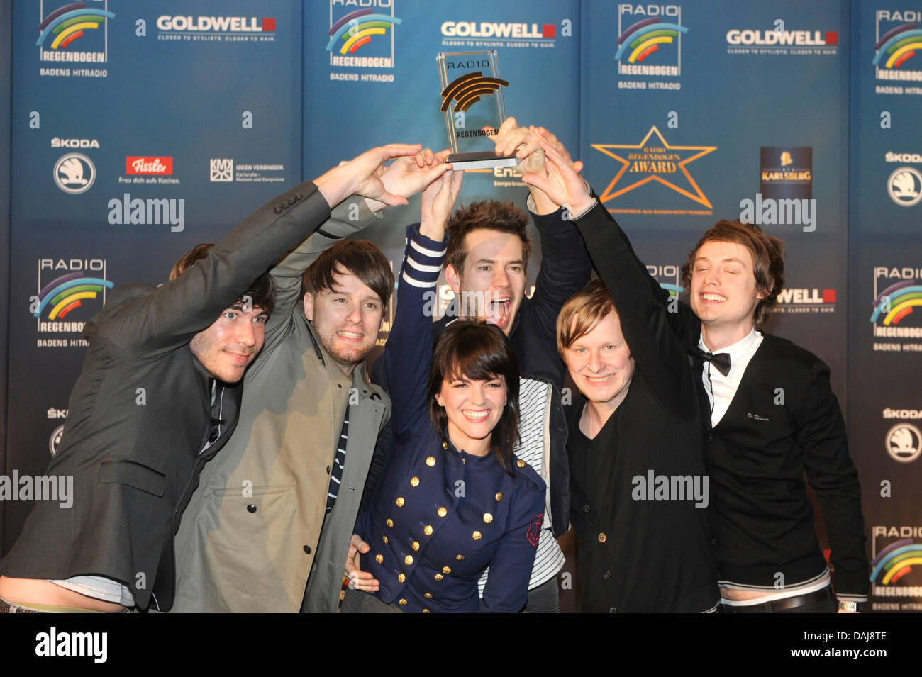 German rock band Revolverheld and Czech singer Marta Jandova pose with their Radio Regenbogen Award in Karlsruhe, Germany, 25 March 2011. The Mannheim-based radio station awards the prize to about a dozen of personalities from media and politics. Photo: Uli Deck Stock Photo