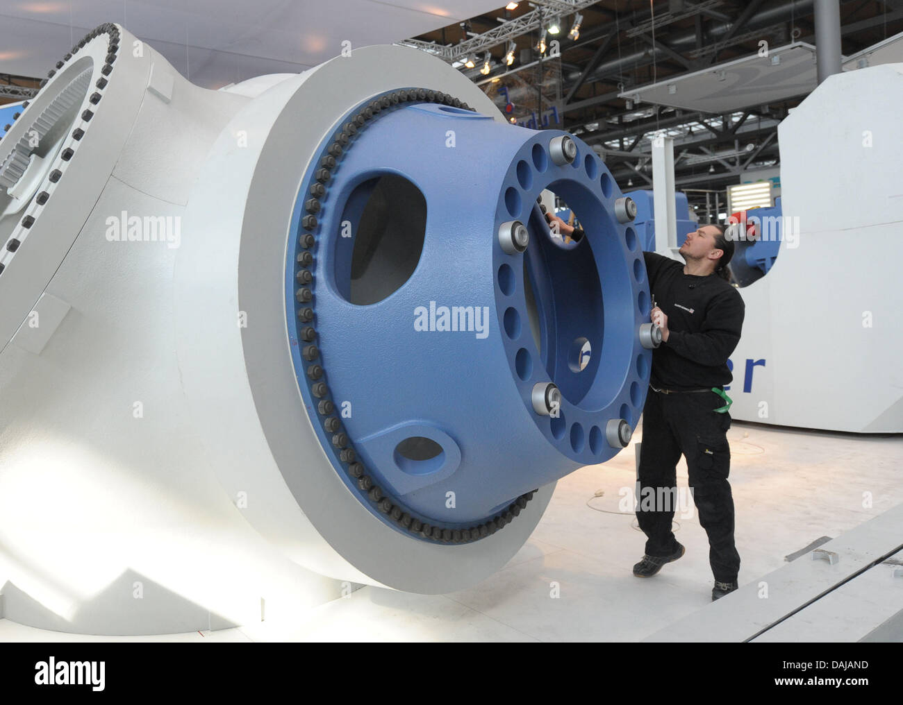 The rotor hub of a wind turbine is seen at the stand for the company Fuhrlander at the convention center for the Hanover Fair 2011 in Hanover, Germany, 30 March 2011. More than 6500 exhibitors from 65 countries are expected in the coming weeks at the world's largest industry fair in Hanover, Germany. Photo: Peter Steffen Stock Photo
