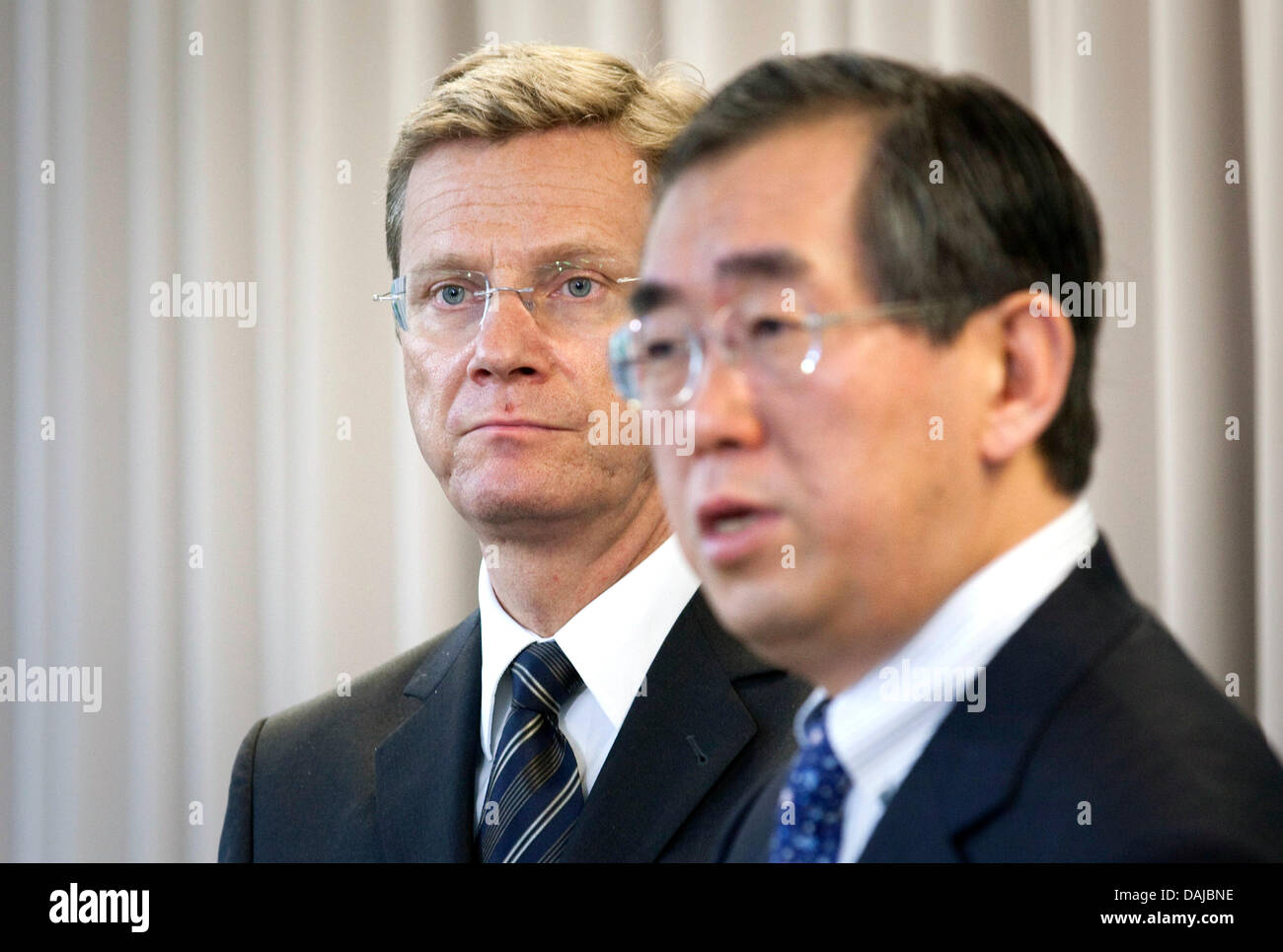 Foreign Minister Westerwelle (FDP, L) speaks during a press conference next to his Japanese counterpart, Takeaki Matsumoto, in Tokyo, Japan, 02 April 2011. Westerwelle traveled to Tokyo to meet with his Japanese counterpart to discuss the situation after the catastrophe. Photo: MICHAEL KAPPELER Stock Photo