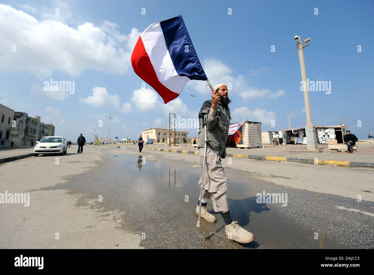 A man carries a French flag in rebel-held Benghazi, Libya, 03 April ...