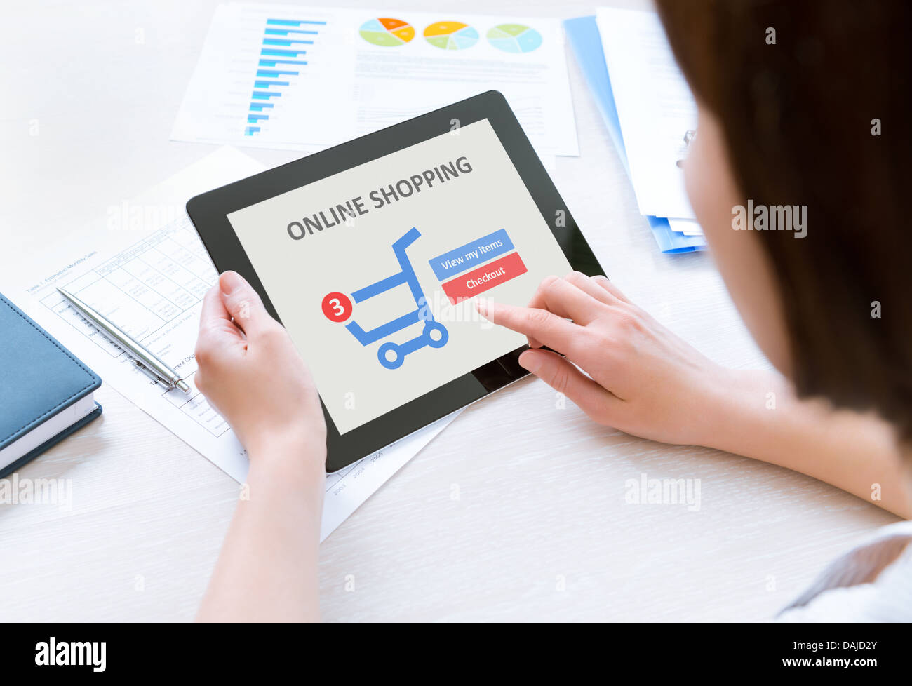 Business person makes a purchase through on-line shopping application on a modern digital tablet Stock Photo