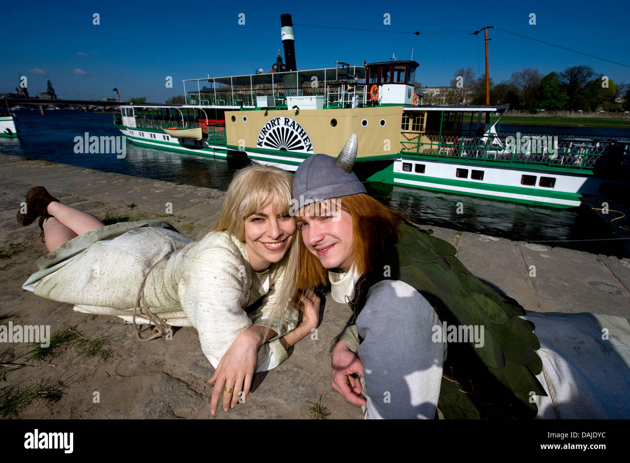 Actors David Mueller alias Wickie (Vicky) and Franziska Hoffmann alias Ylvi pose in front of the steamboat 'Kurort Rathen' in Dresden, Germany, 07 April 2011. 'Mein Freund Wickie' (My Friend Vicky) celebrates its premiere on 11 June at the outdoor theater Felsenbuehne Rathen and guests will be brought with the steamboat directly to the stage in Saxon Switzerland near Dresden. Photo Stock Photo