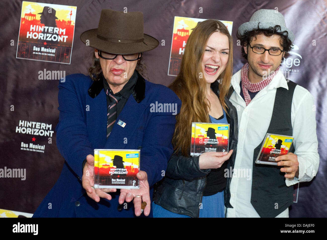 Musician Udo Lindenberg (L) along with actors from the musical "Hinterm  Horizont" (Behind the Horizon) Josephin Busch ("Jessy") and Serkan Kaya  ("Udo") introduce a CD for the musical in front of the