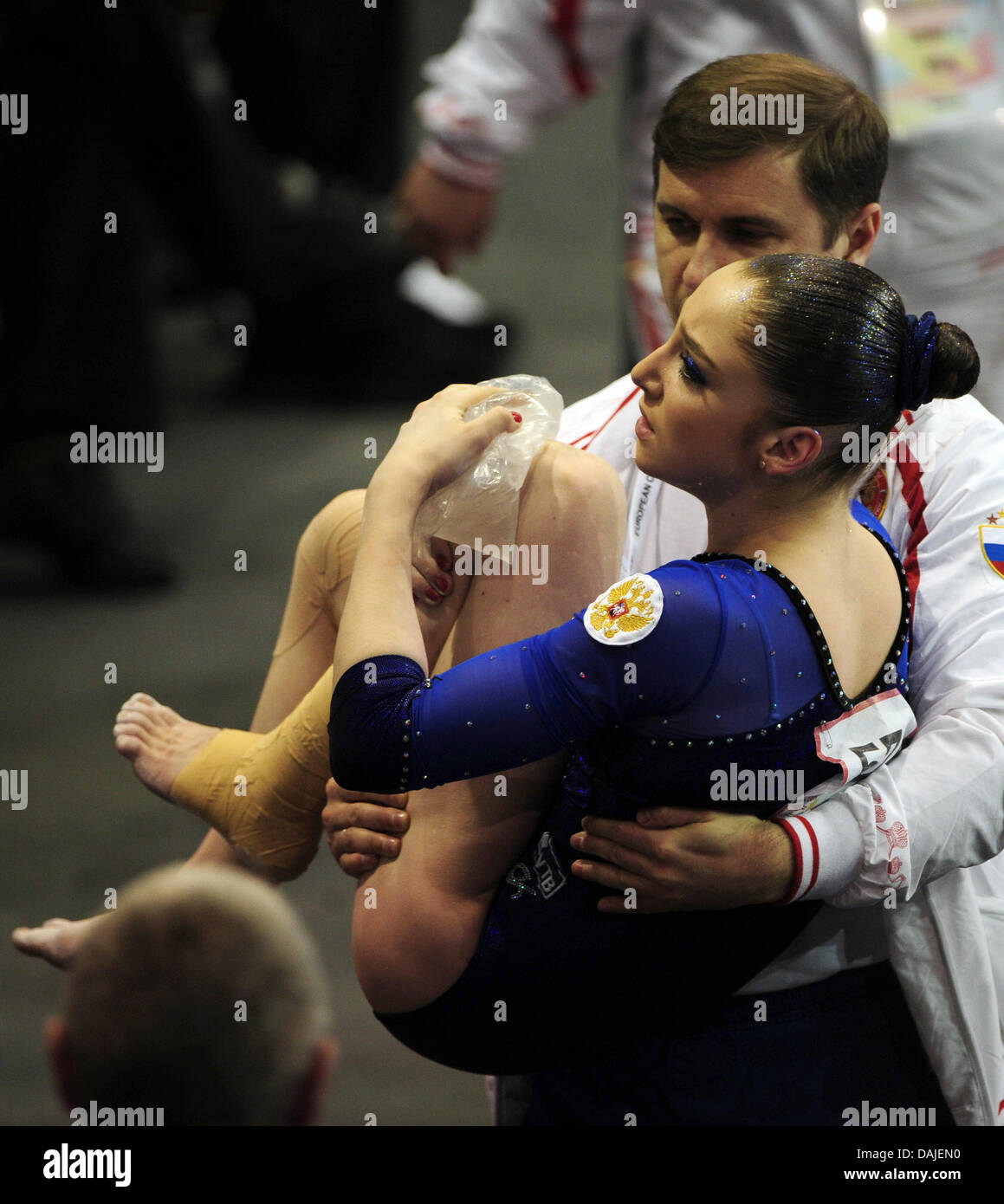 Russian athlete Aliya Mustafina is being carried off the floor after  twisting her knee during a jump in the women's all around finals during the  2011 European Championships in artisitic gymnastics at