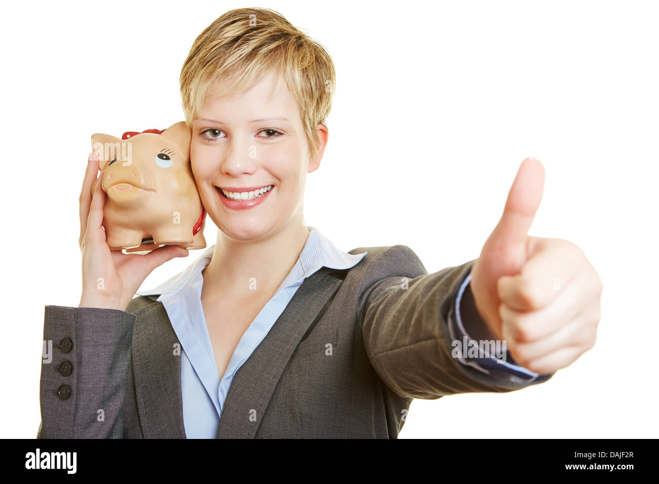 Young business woman with a piggy bank holding her thumbs up Stock ...