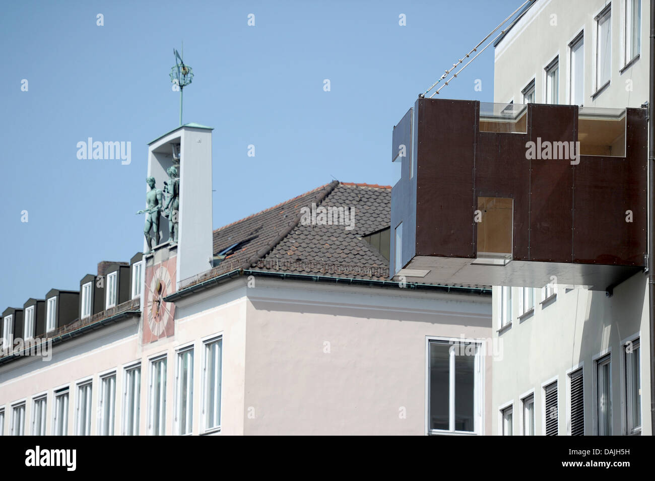 The 'Rucksack House' hangs on a building in the city center in Bamberg,  Germany, 10 April 2011. The 'Rucksack House' is an accessible sculpture by  the artist Stefan Eberstadt. This mini house