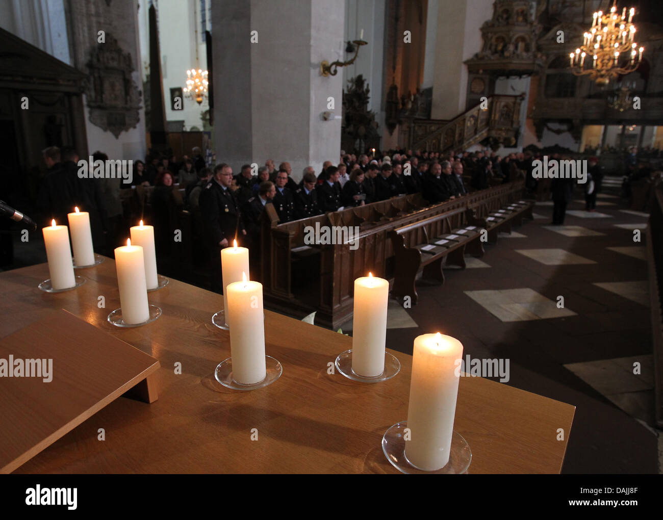 For every of the eight victims of the massive collision on A 19 a candle is burning during the funeral service in the Marienkirche in Rostock, Germany, 13 April 2011. The accident on 8 April 2011 is said to be the biggest collision in germany since 20 years. PHOTO: BERND WUESTNECK Stock Photo