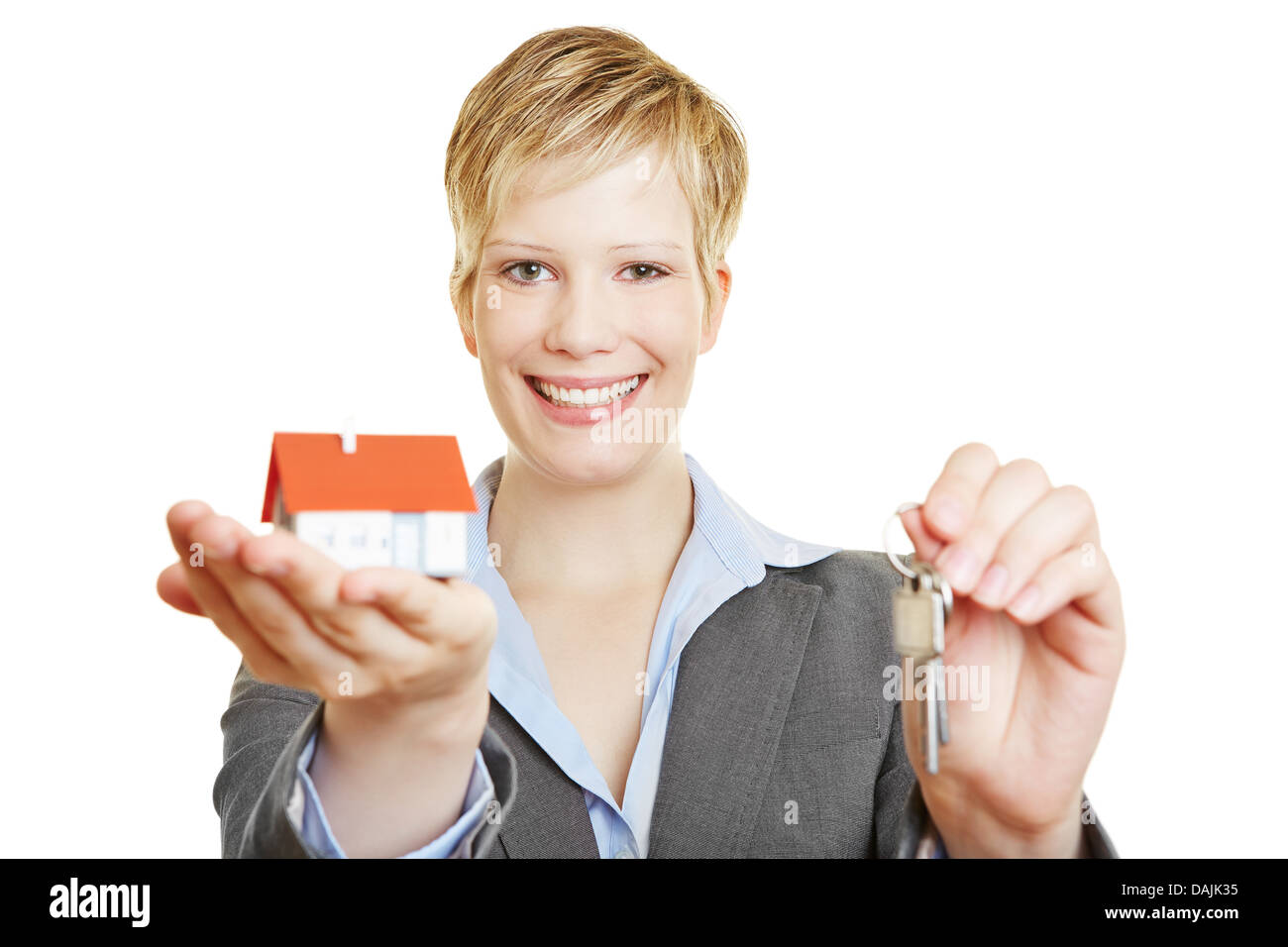 Young business woman with a small house and keys Stock Photo - Alamy
