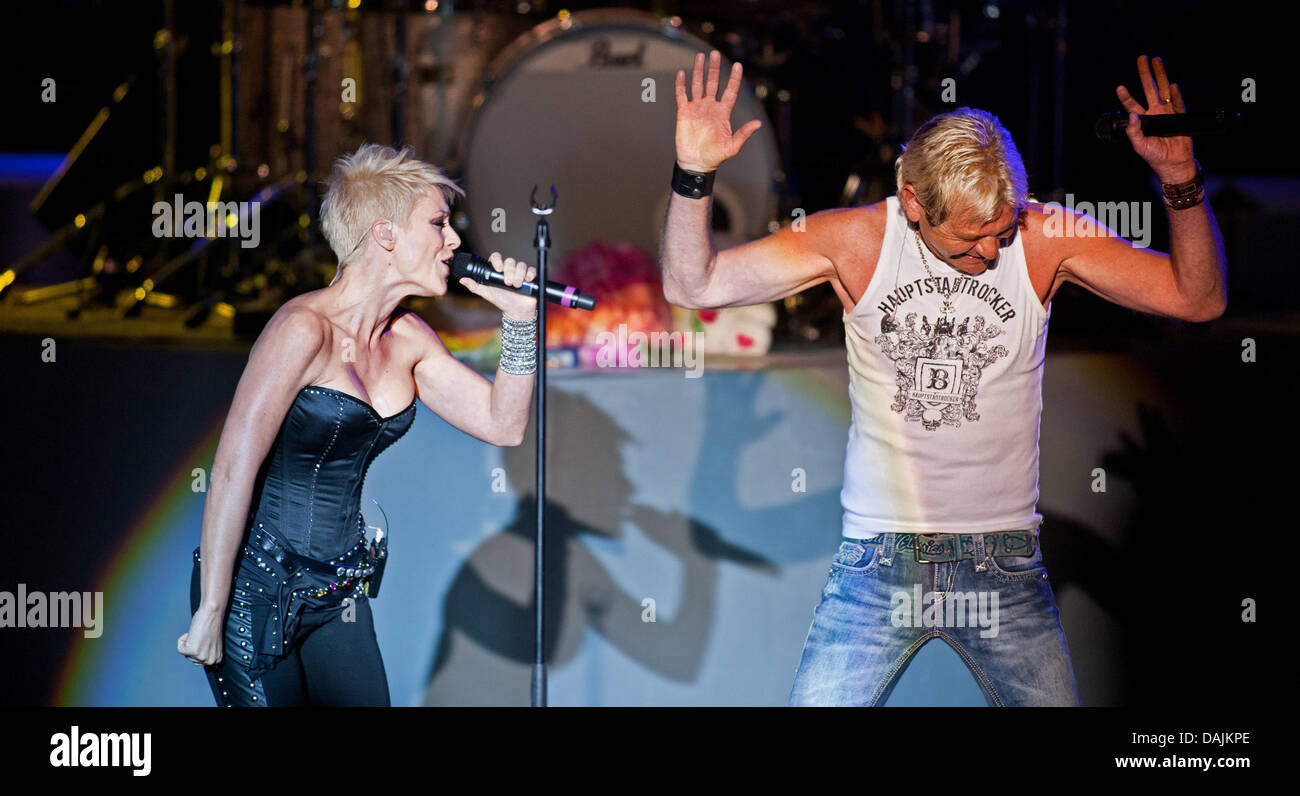 German 'Schlager' singer Michelle and her ex-husband Matthias Reim perform their song 'Idiot' together on stage during a concert in Dresden, Germany, 17 April 2011. It was their first performance together after years of separation. Photo: Oliver Killig Stock Photo