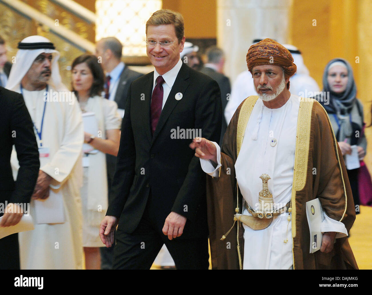German Foreign Minister Guido Westerwelle  and State Secretary in the Federal Ministry for Foreign Affairs of the United Arab Emirates Anbar Al Gargash (R) walk to a group photo during the EU meeting with the Gulf Cooperation Council at the Emirates Palace Hotel in Abu Dhabi, United Arab Emirates, 20 April 2011. Photo: HANNIBAL Stock Photo