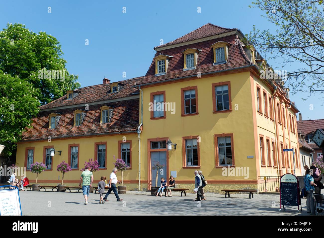 Tourists and passers-by stroll past the Wittumspalais in Weimar, Germany, 22 April 2011. Anna Amalia, Duchess of Saxe-Weimar-Eisenach, purchased the estate and property in 1774 and used it as her retirement seat and widow residence after the death of her husband Ernst August II Konstantin, Duke of Saxe-Weimar-Eisenach, in 1758. The fact that she was a widow gave the palace its name Stock Photo