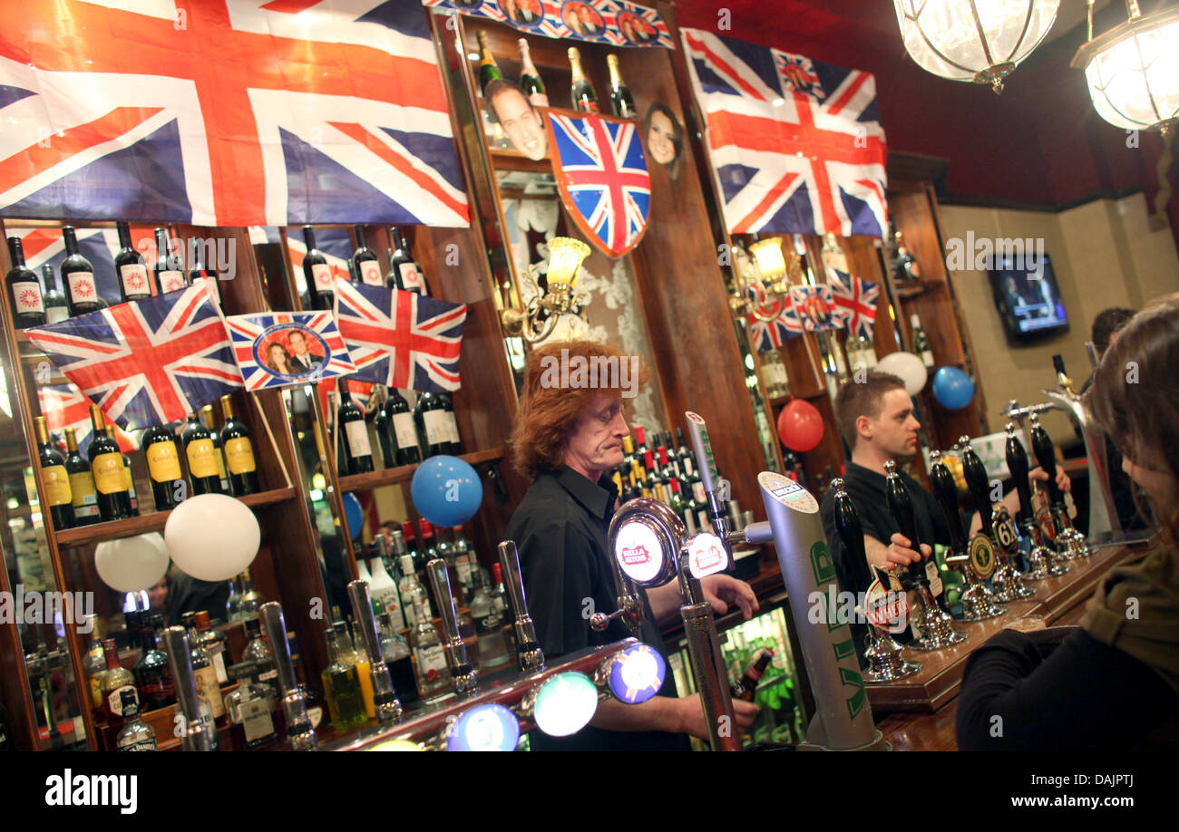 A pub is decorated with British Union Jack Flags and pictures of Prince