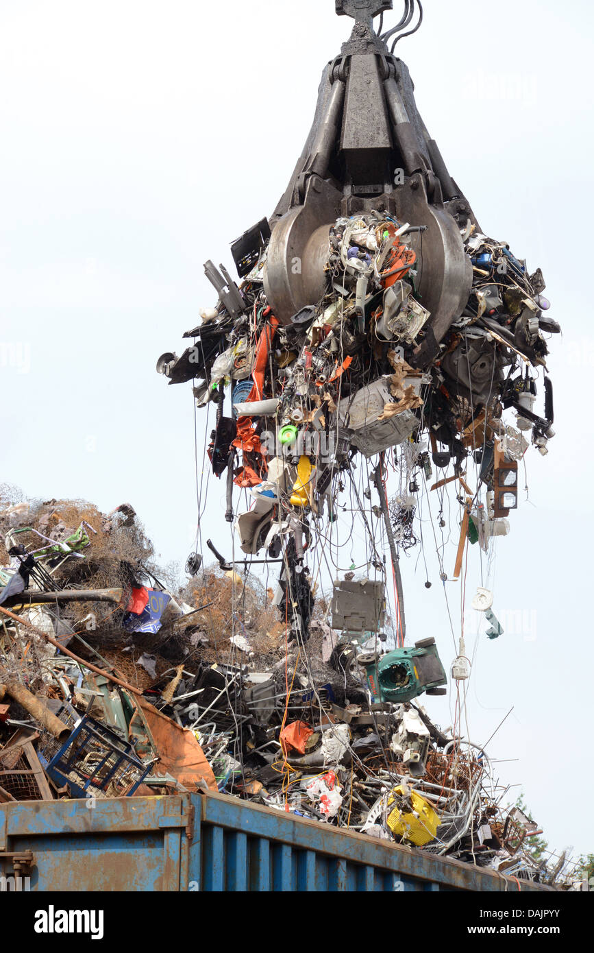disposal of WEEE waste electronic and electrical equipment being loaded into wagon at processing
