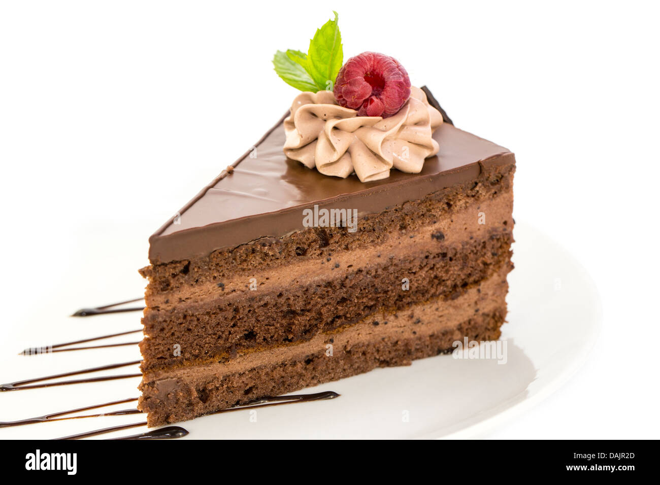 piece of chocolate cream cake on a white background in the restaurant ...
