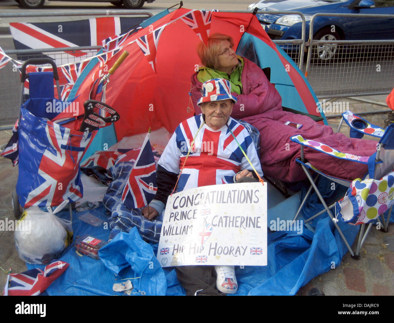 Terry Hutt (L) and Jennifer Hawkins sit in their tent in front of Westminster Abbey waiting for the upcoming royal wedding in London, great Britain, 27 April 2011. Prince William and his bride to be Kate Middleton will get married at Westminster Abbey on 29 April. Photo: Thomas Pfaffe dpa Stock Photo