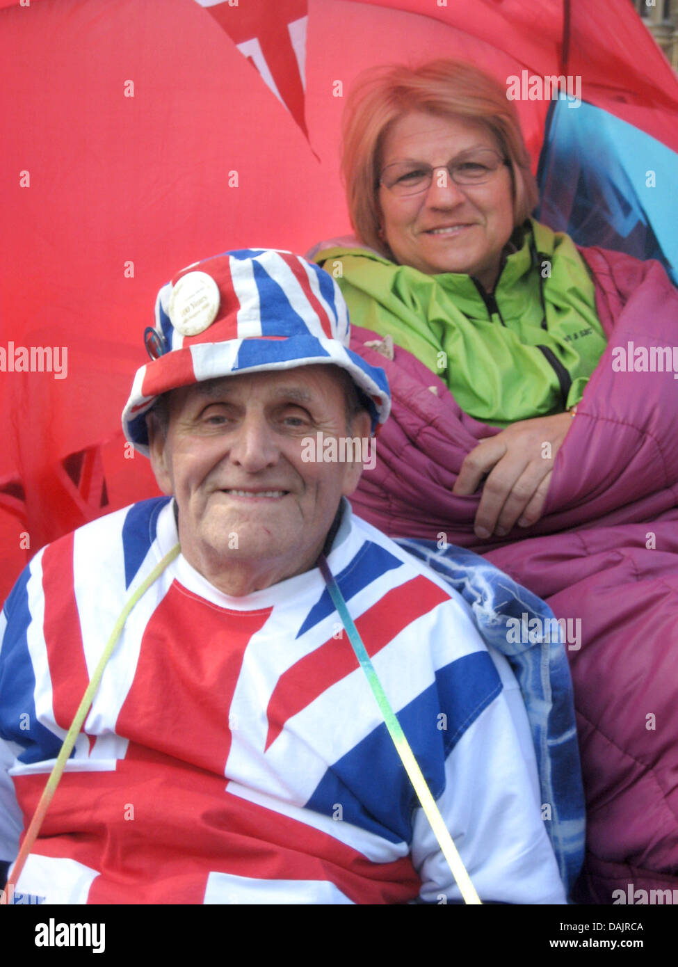 Terry Hutt (L) and Jennifer Hawkins sit in their tent in front of Westminster Abbey waiting for the upcoming royal wedding in London, Great Britain, 27 April 2011. Prince William and his bride to be Kate Middleton will get married at Westminster Abbey on 29 April. Photo: Thomas Pfaffe Stock Photo