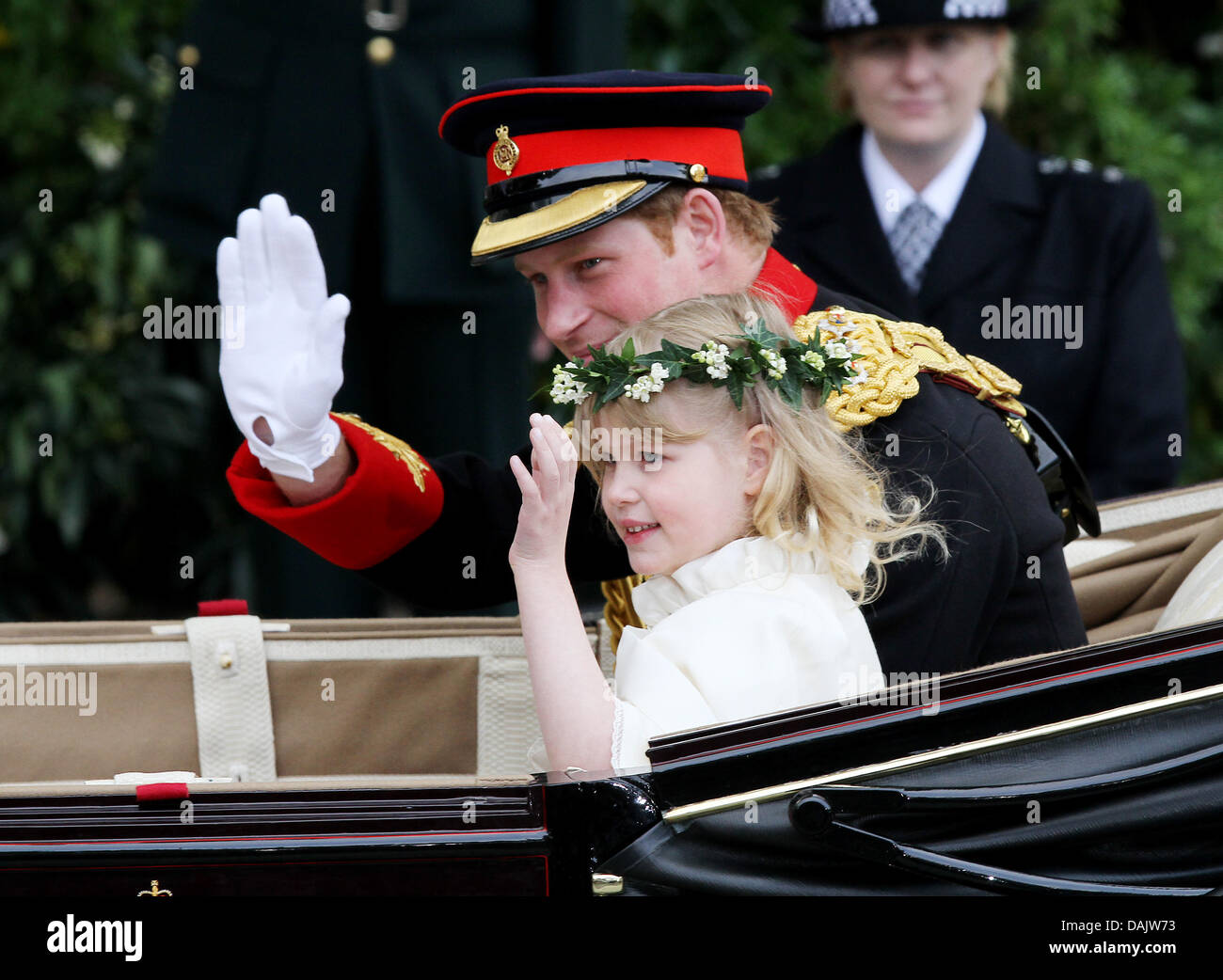 Prince Harry and Lady Louise Windsor ride in a horse-drawn carriage from Westminster Abbey to Buckingham Palace in London, Britain, 29 April 2011, after the wedding ceremony of Prince William and Kate Middleton. Some 1,900 guests followed the royal marriage ceremony of Prince William and Kate Middleton in the church. Photo: Patrick van Katwijk Stock Photo
