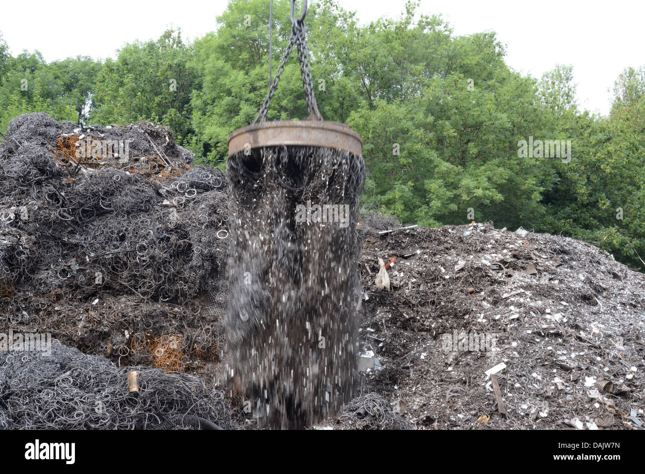 Scrap Rig magnetic grab on crane lifting scrap metal at scrapyard uk Stock Photo ...
