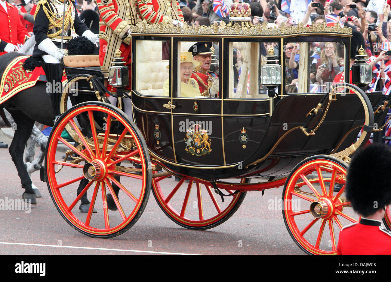 Queen Elizabeth II and Prince Philip leave in a horsedrawn carriage
