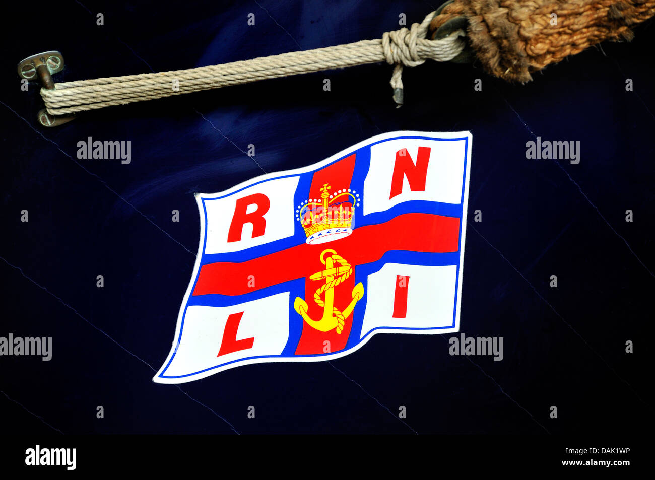 Chatham, Kent, England. Chatham Historic Dockyard. RNLI Historic Lifeboat Collection. Detail of hull, with flag insignia Stock Photo
