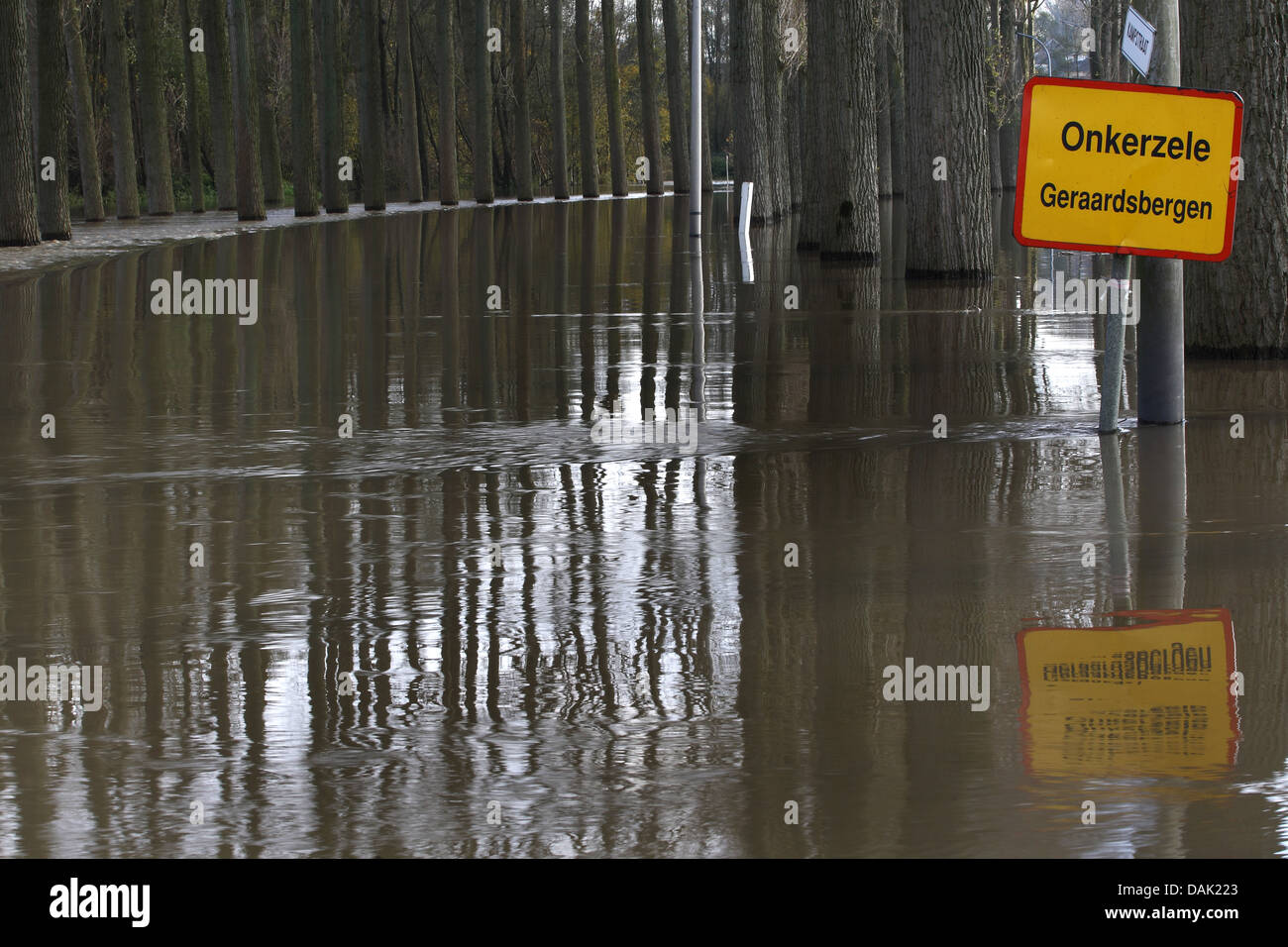 flooded avenue and place name sign, Belgium, Oost-Vlaanderen, Onkerzele Stock Photo