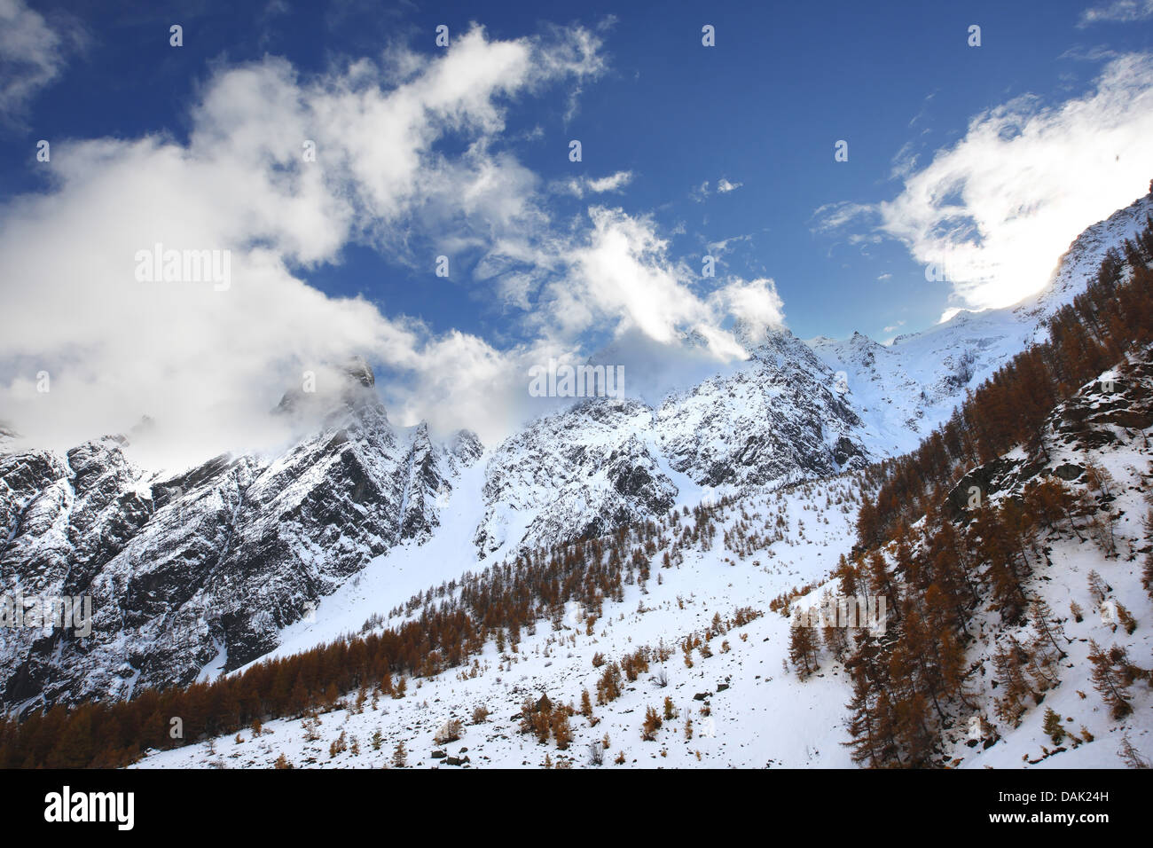 looming snow-covered mountain slopes at the Col d'Arsine, France Stock Photo