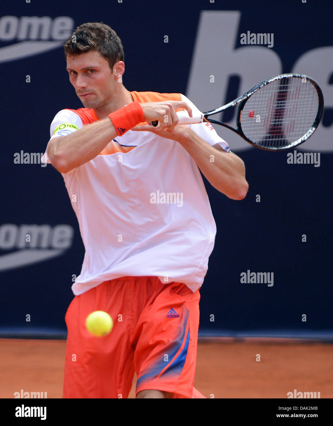 German tennis player Daniel Brands hits the ball during a first round match  against Lorenzi from Italy at the ATP tournament in Hamburg, Germany, 15  July 2013. Photo: Axel Heimken Stock Photo - Alamy