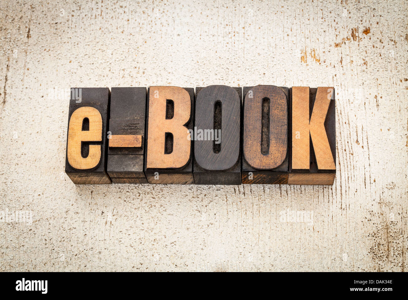 e-book word in vintage letterpress wood type on a grunge painted barn wood background Stock Photo