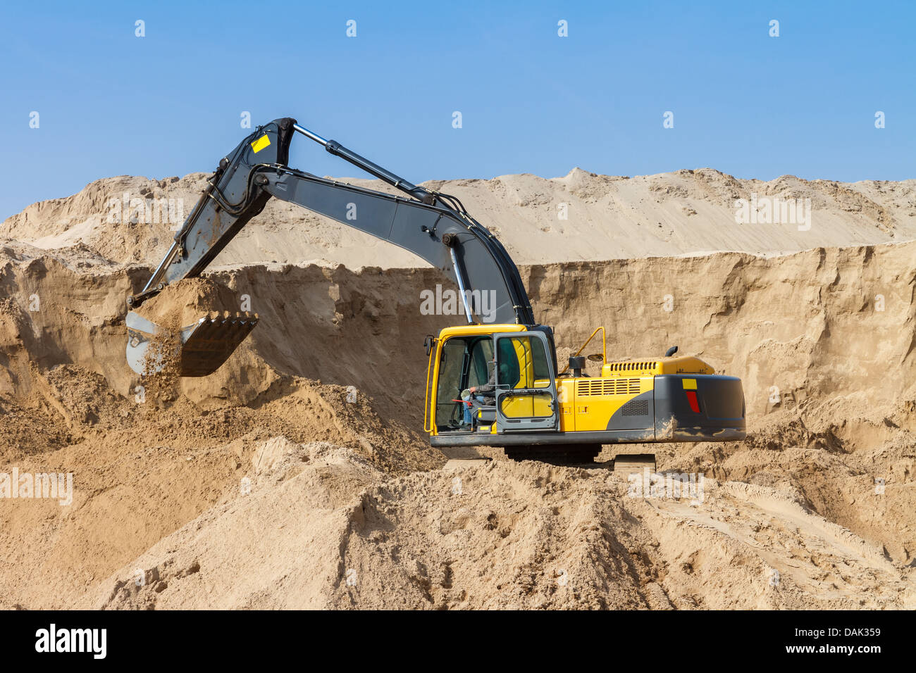 Yellow Excavator work at Construction Site Stock Photo - Alamy