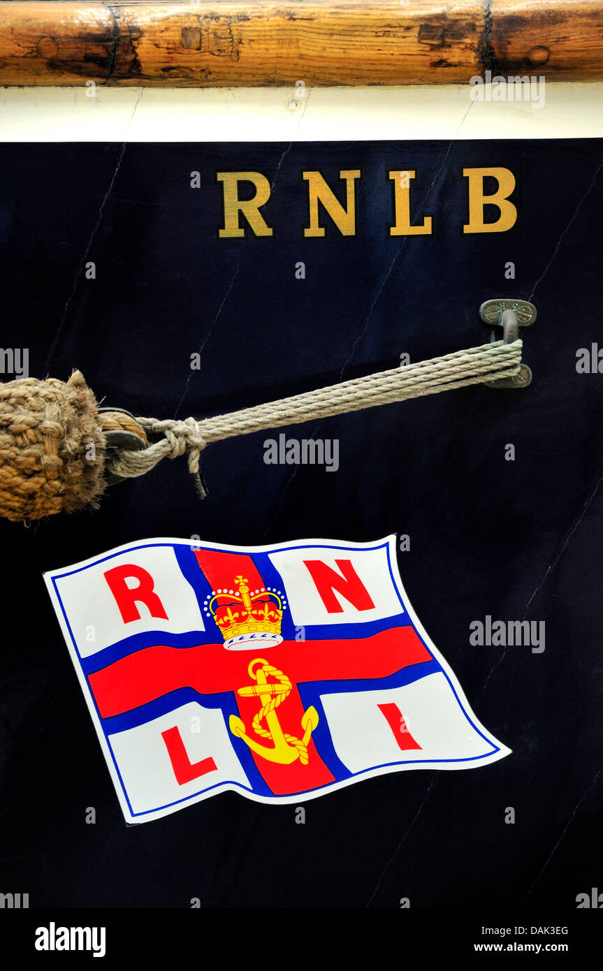 Chatham, Kent, England. Chatham Historic Dockyard. RNLI Historic Lifeboat Collection. Detail of hull, with flag insignia Stock Photo