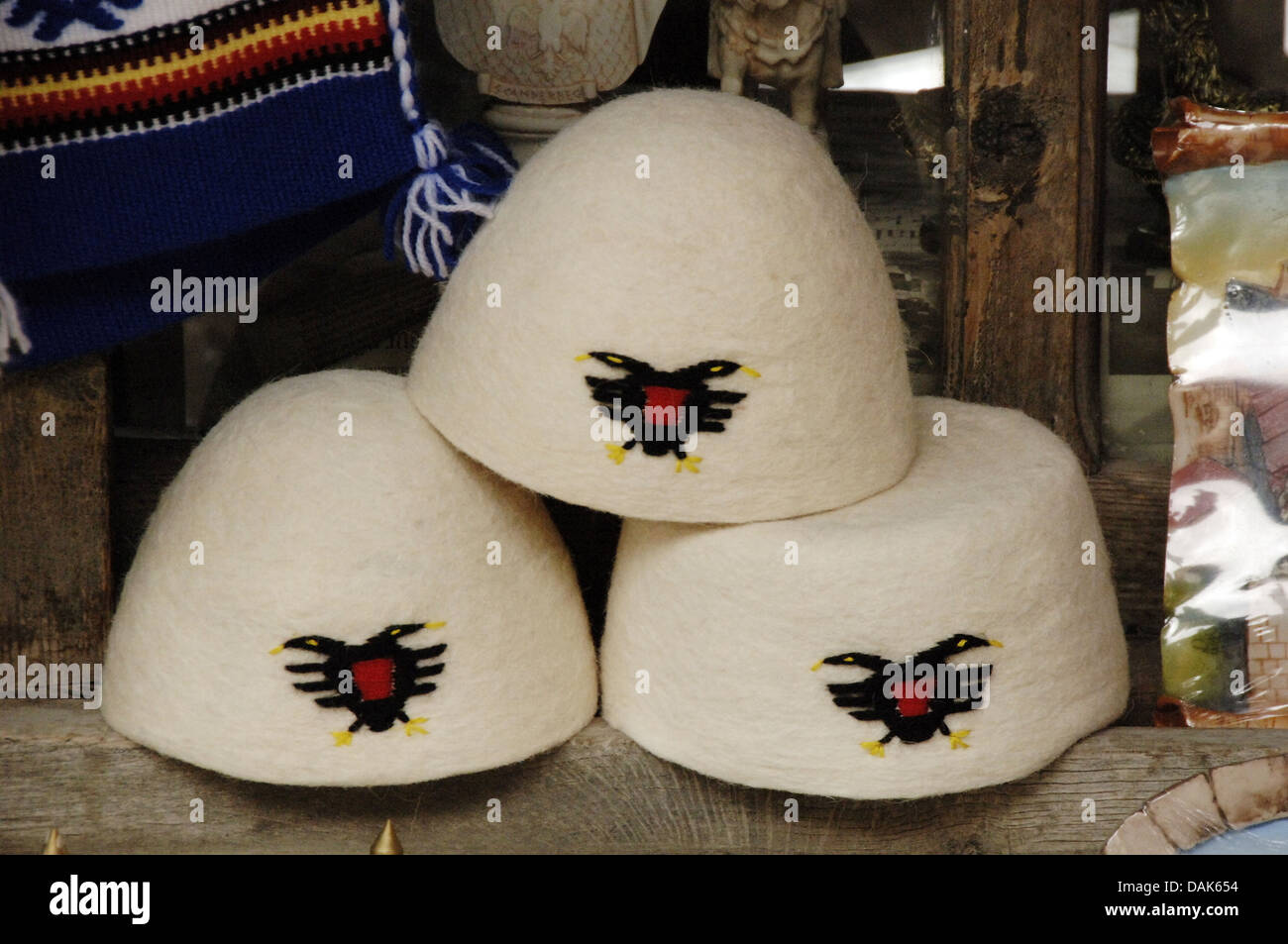 Albania. Kruje. Selling hats with the coat of Albania. Bazaar. Stock Photo
