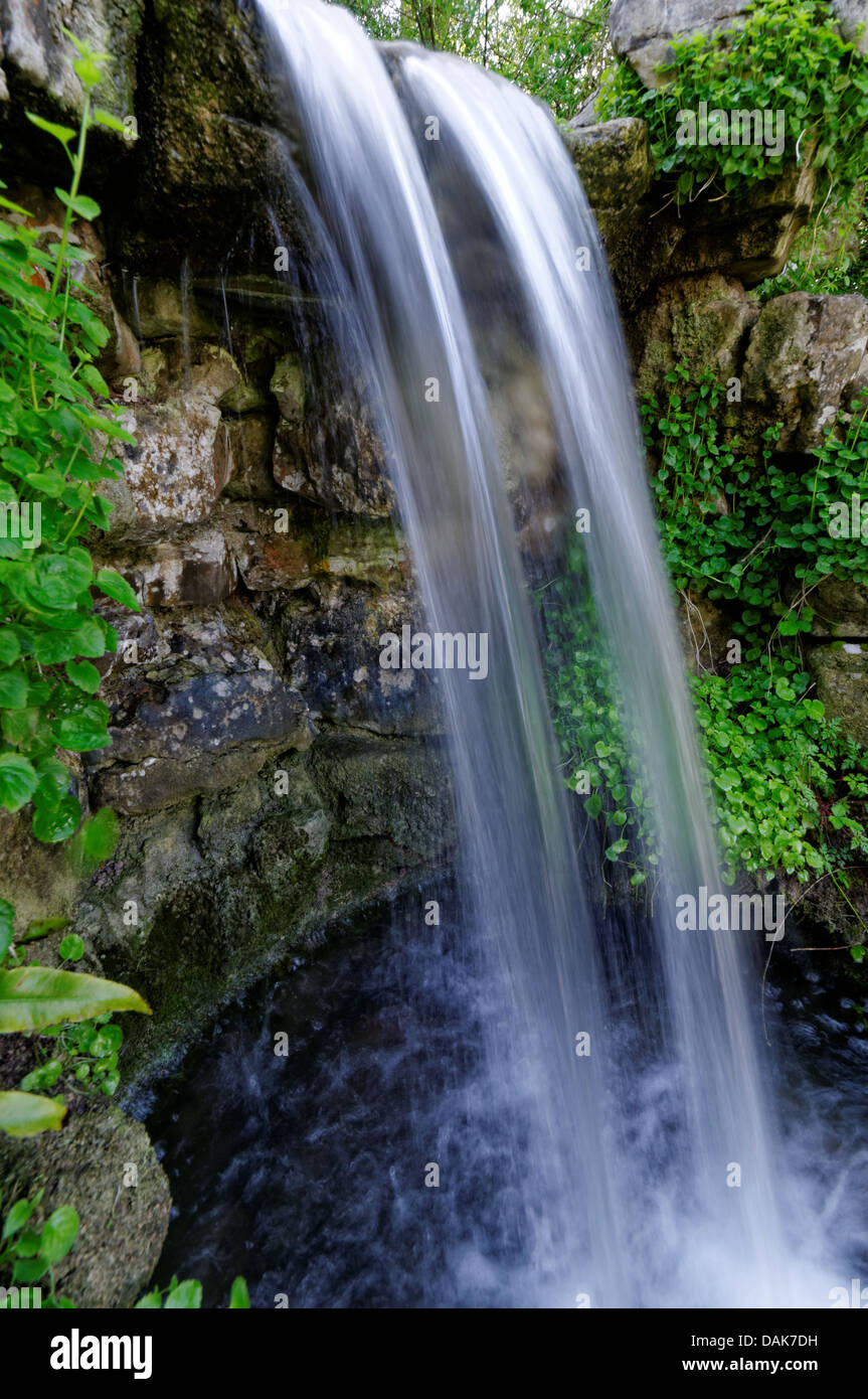 Small Waterfall photographed with a slow shutter speed creating a feeling of a poetic nature.The Rookery, Rock Garden,Brighton Stock Photo