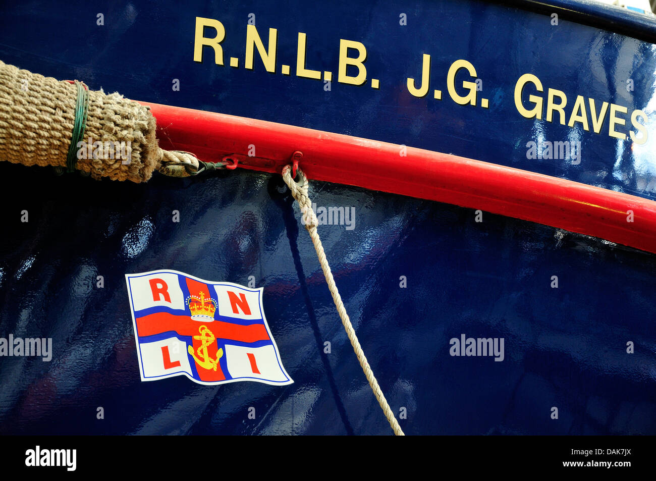 Chatham, Kent, England. Chatham Historic Dockyard. RNLI Historic Lifeboat Collection. Detail of hull, with flag insignia. Stock Photo