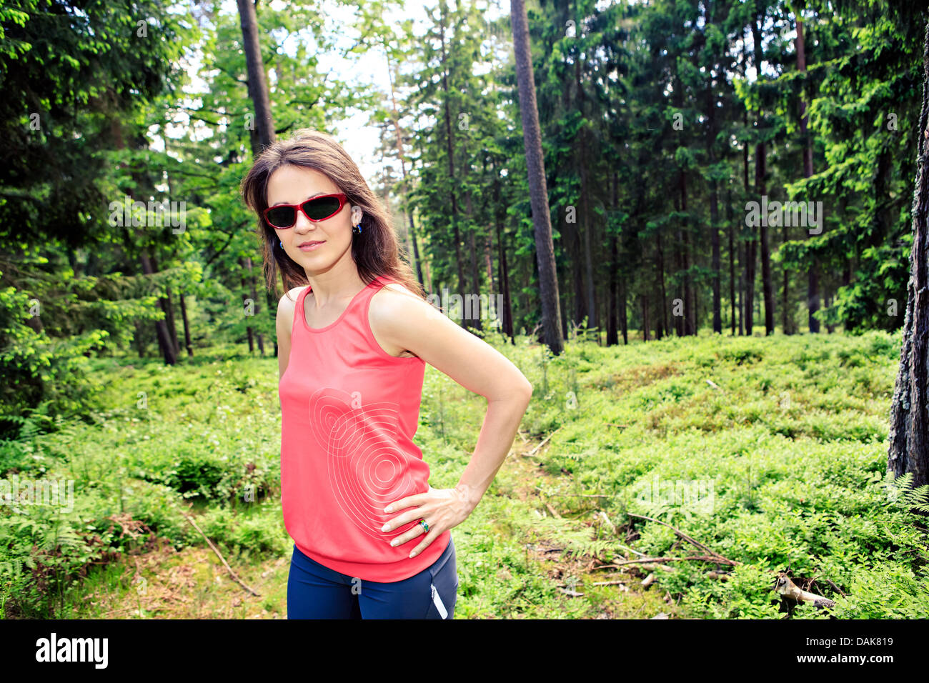 young woman jogging in a forest Stock Photo - Alamy