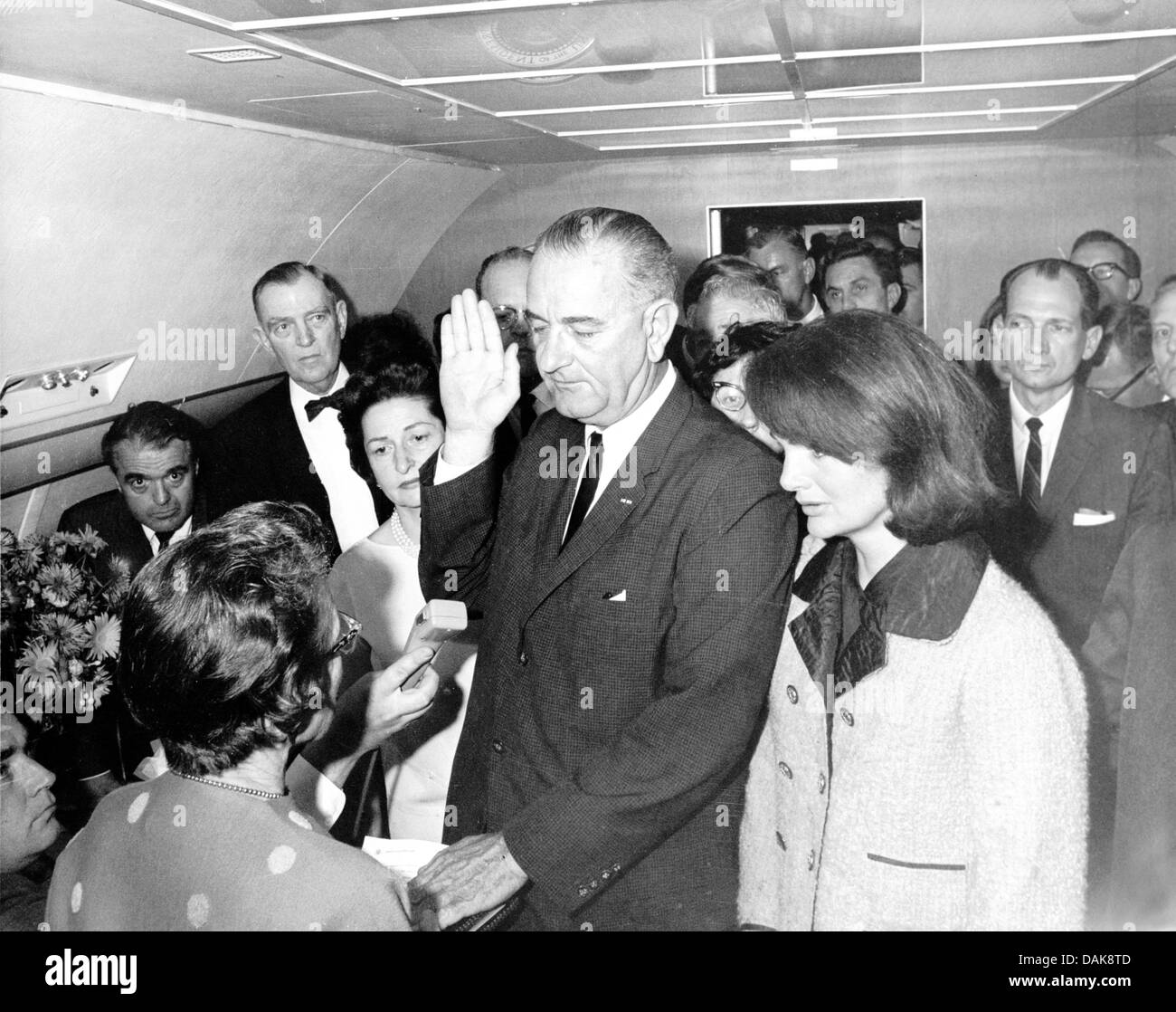 LYNDON B. JOHNSON is sworn in as President aboard Air Force One 22 November 1963 - see Description below Stock Photo
