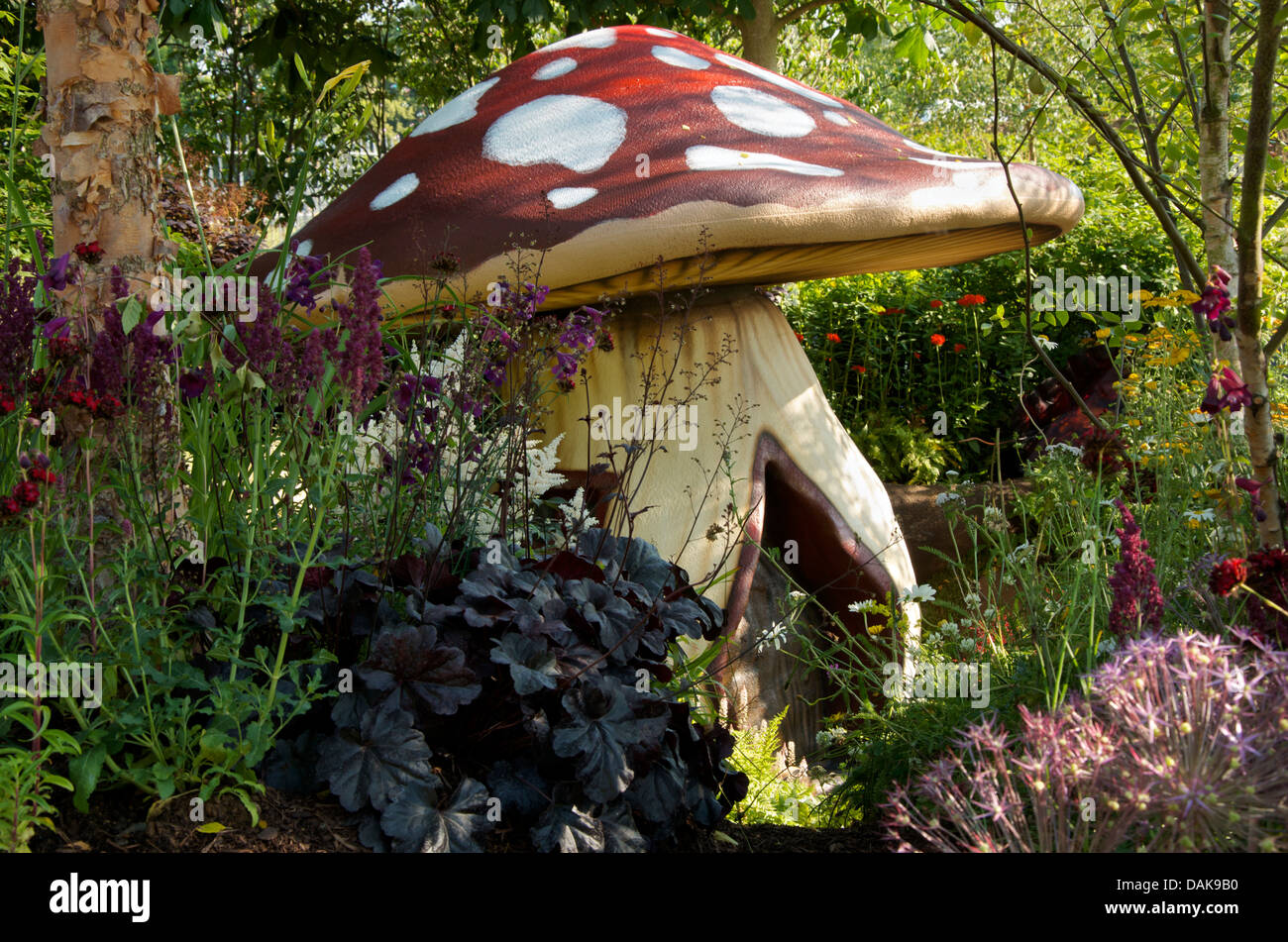 Giant toadstool The One Show Garden at RHS Hampton Court Palace Flower Show 2013, London, UK Stock Photo