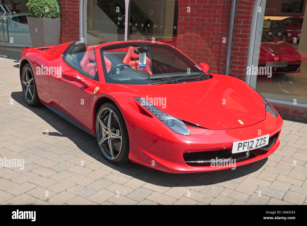 A Ferrari 458 Spider 2012 '12' supercar outside Meridien Modena