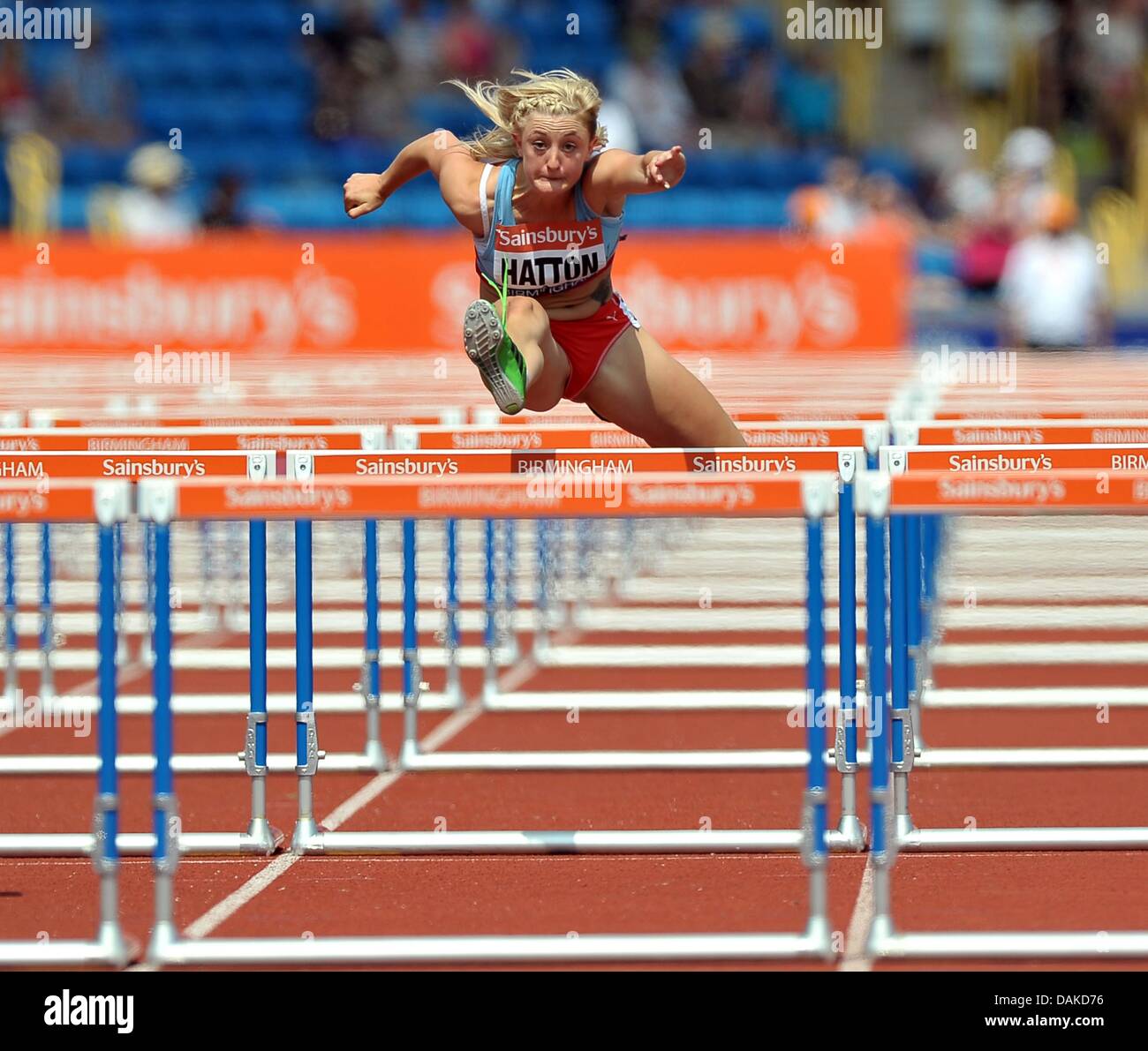 Lucy Hatton celebrates winning her heat in the Women's 100m hurdle