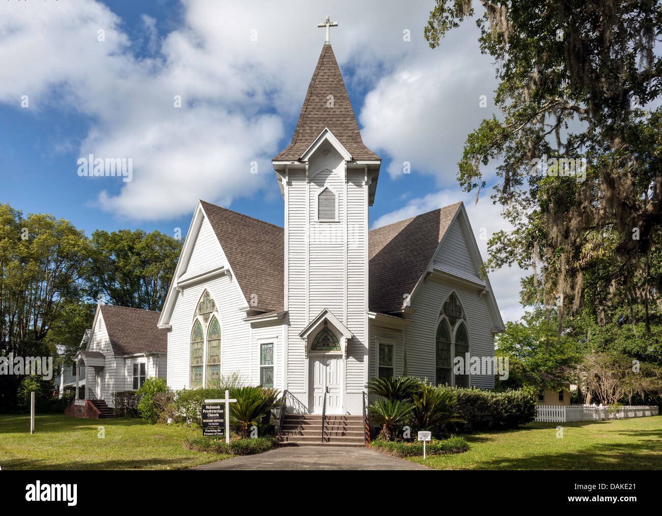 Historic McIntosh Presbyterian Church (c.1907) a quaint white clapboard rural Florida church sited at an angle on a corner lot. Stock Photo