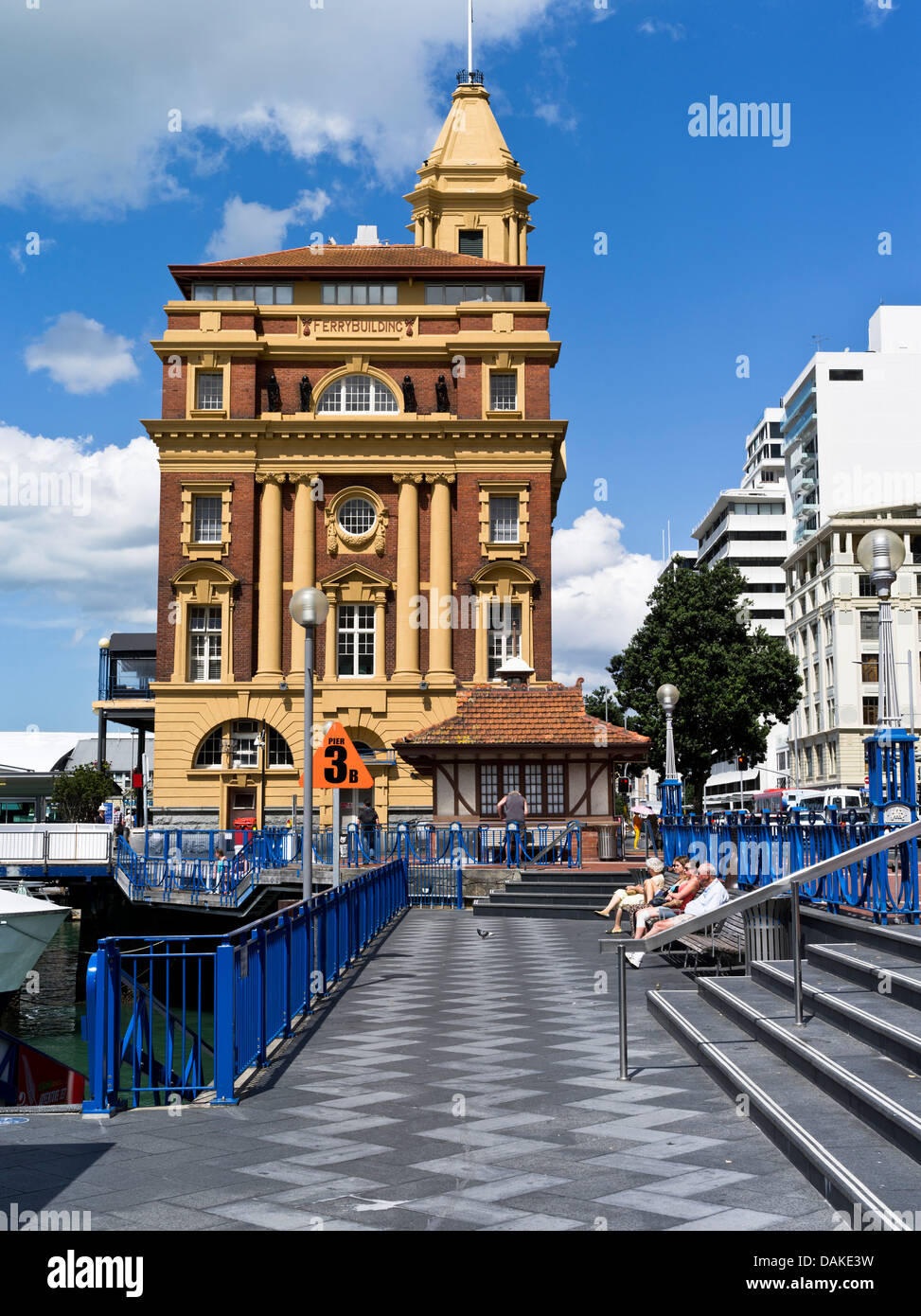 dh Ferry terminal building AUCKLAND HARBOUR NEW ZEALAND NZ Pier people sitting relaxing waterfront Stock Photo