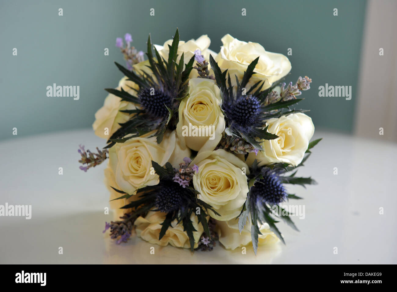 Wedding bouquet of white roses and purple heather Stock Photo