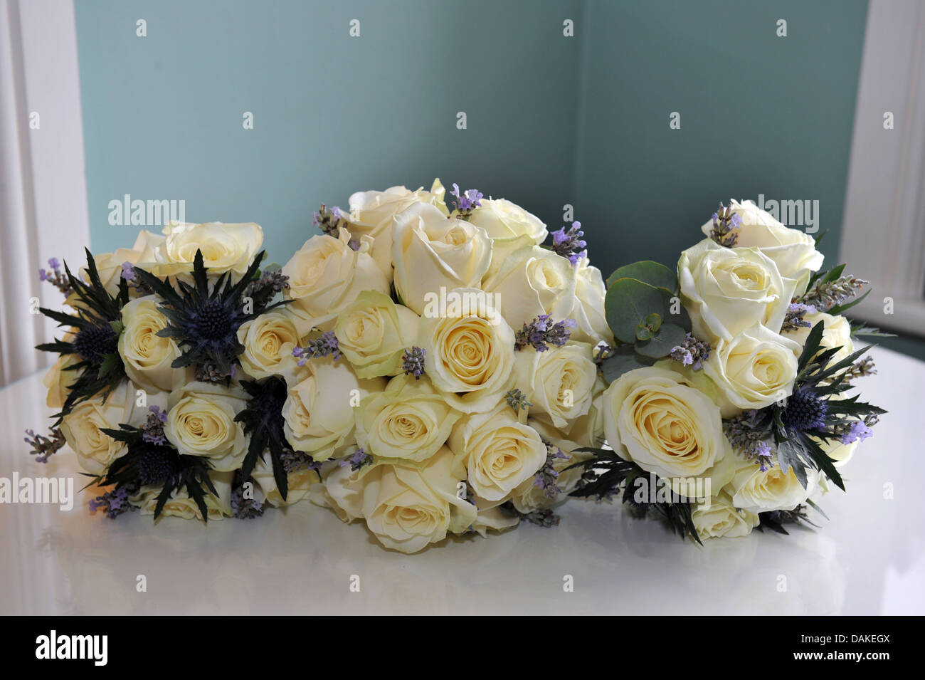 Wedding bouquet of white roses and purple heather Stock Photo