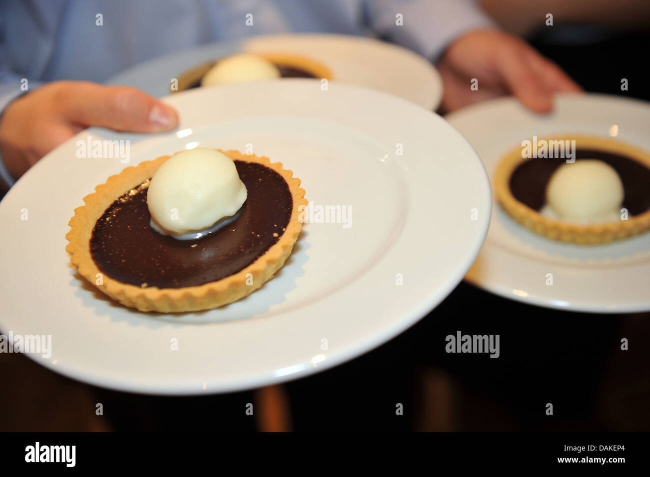 Chocolate Cream tart served on plates at a wedding Stock Photo