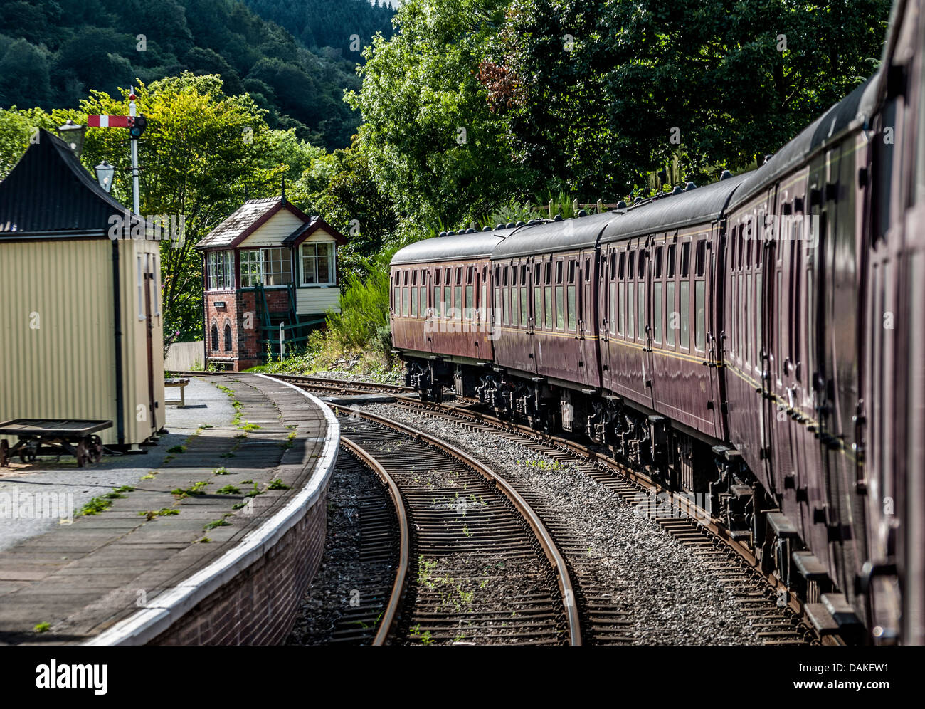 Old train carriages at a station platform with old signal boxes. Stock Photo